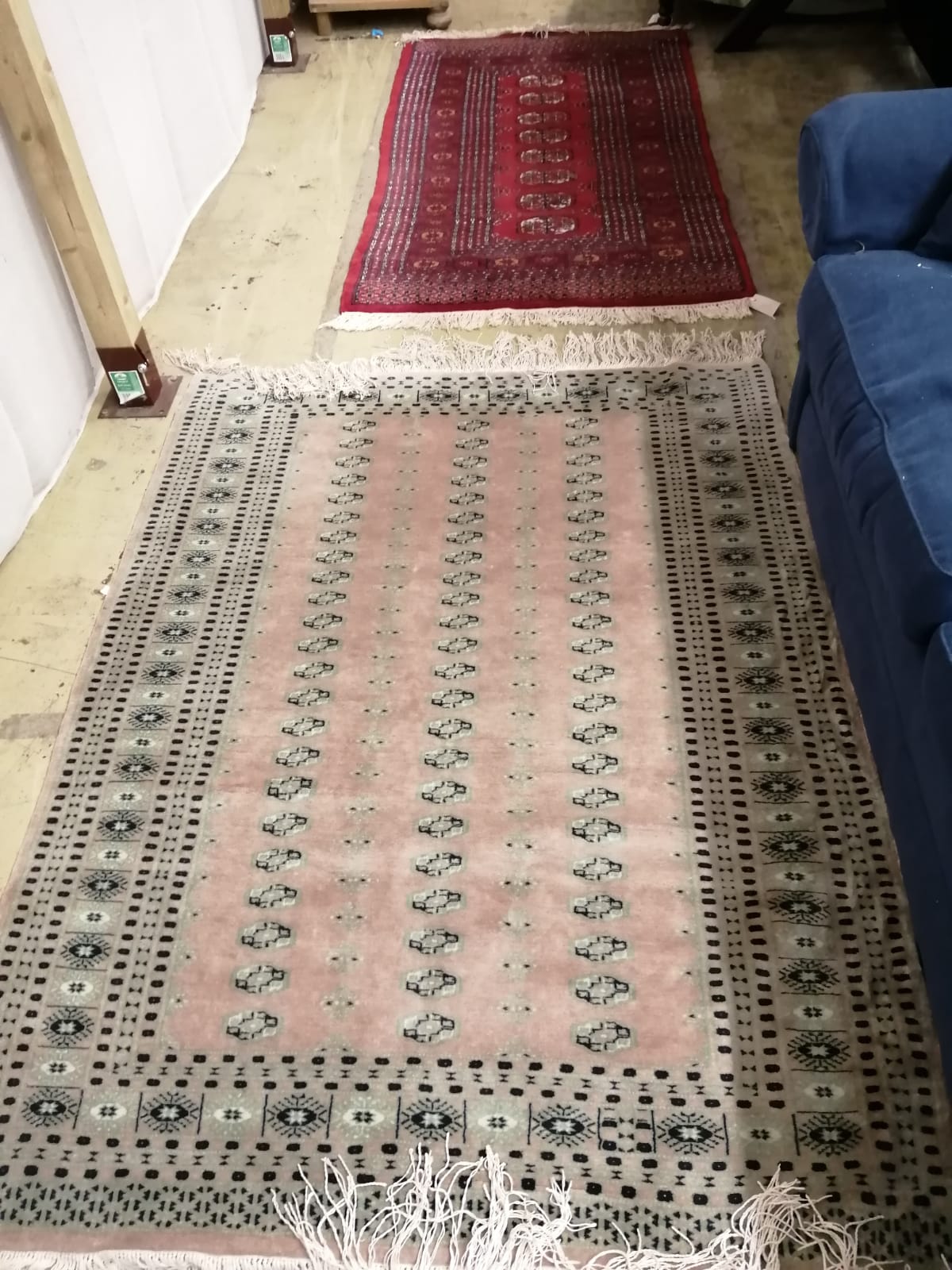 A Bokhara style rug, 166 x 97cm and another pale pink ground rug
